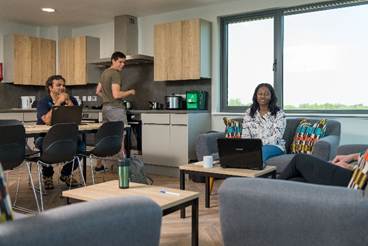 A group of people in a room
AI-generated content may be incorrect.